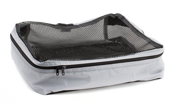 An empty and open Northwest Sky (light grey) Aether Large Aeronaut 45 Packing Cube.